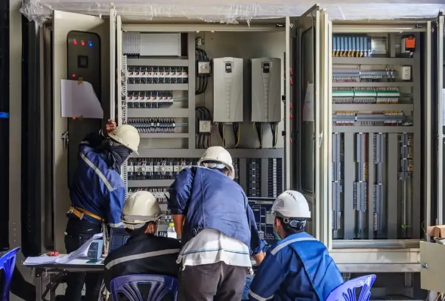 Emergency industrial electrical contractor repairs being conducted in an industrial facility.